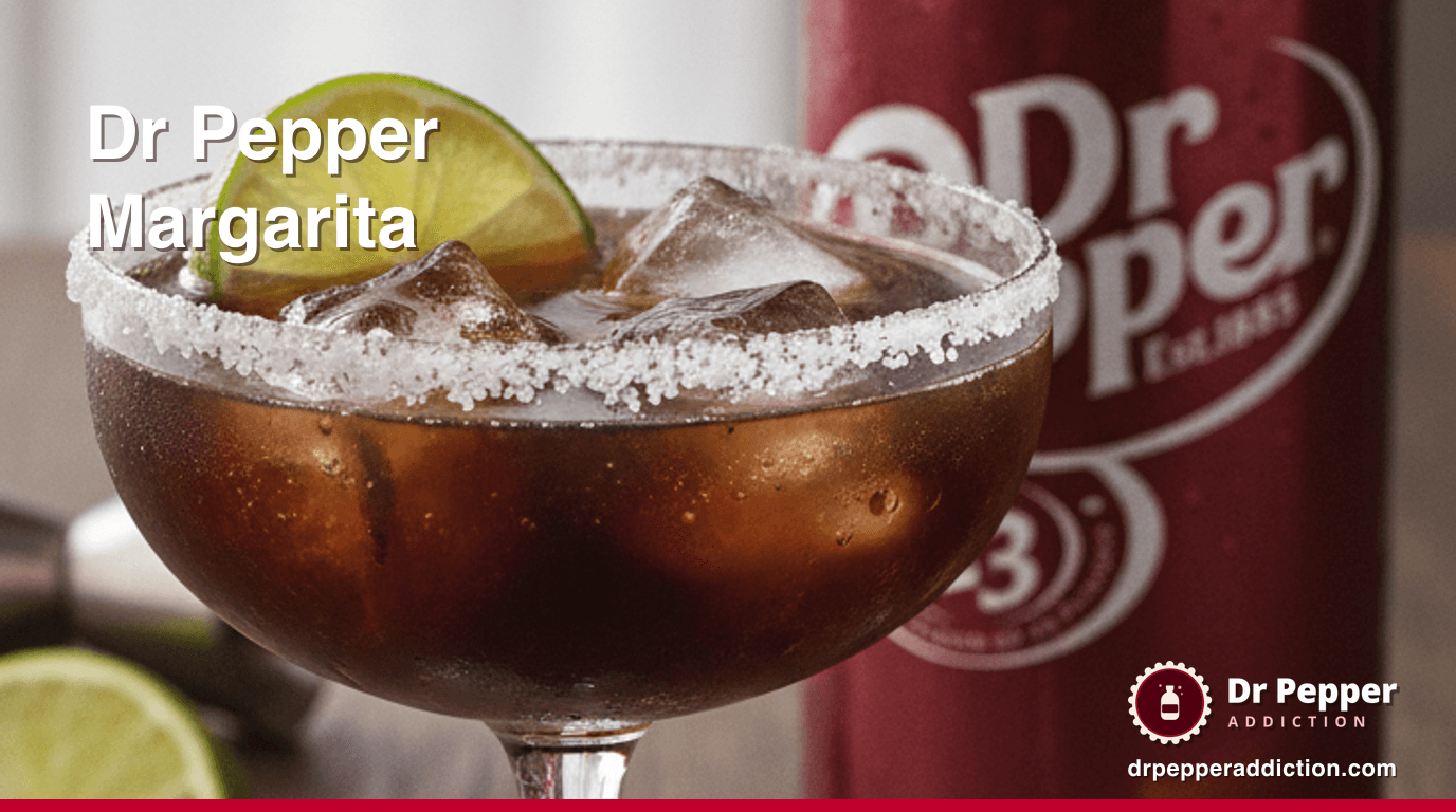 A salt-rimmed Dr Pepper margarita over ice with a lime wheel, a can of Dr Pepper beside it