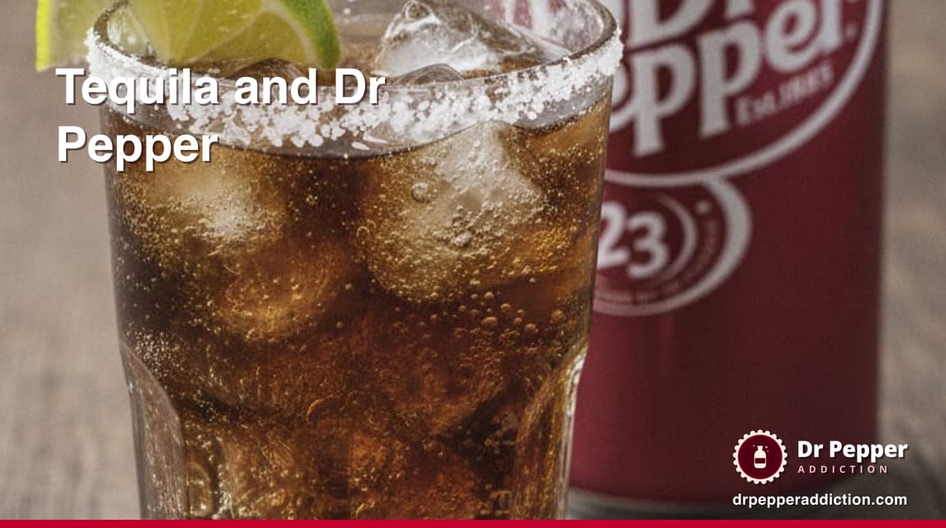 A tall highball glass of dark cola-colored soda over ice with a lime wedge on the rim and coarse salt on half the rim, on a weathered wooden table beside a can of Dr Pepper
