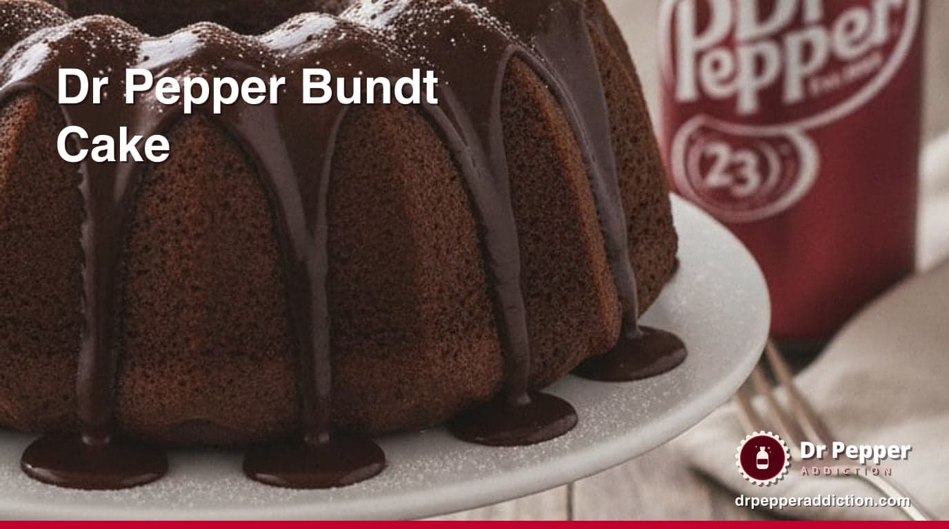 A Dr Pepper chocolate bundt cake with glossy glaze dripping down the ridges, a can of Dr Pepper beside it