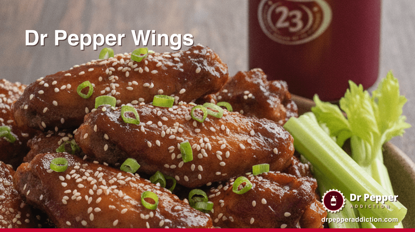 A platter of sticky Dr Pepper glazed chicken wings with sesame, scallions and celery, a can of Dr Pepper beside it